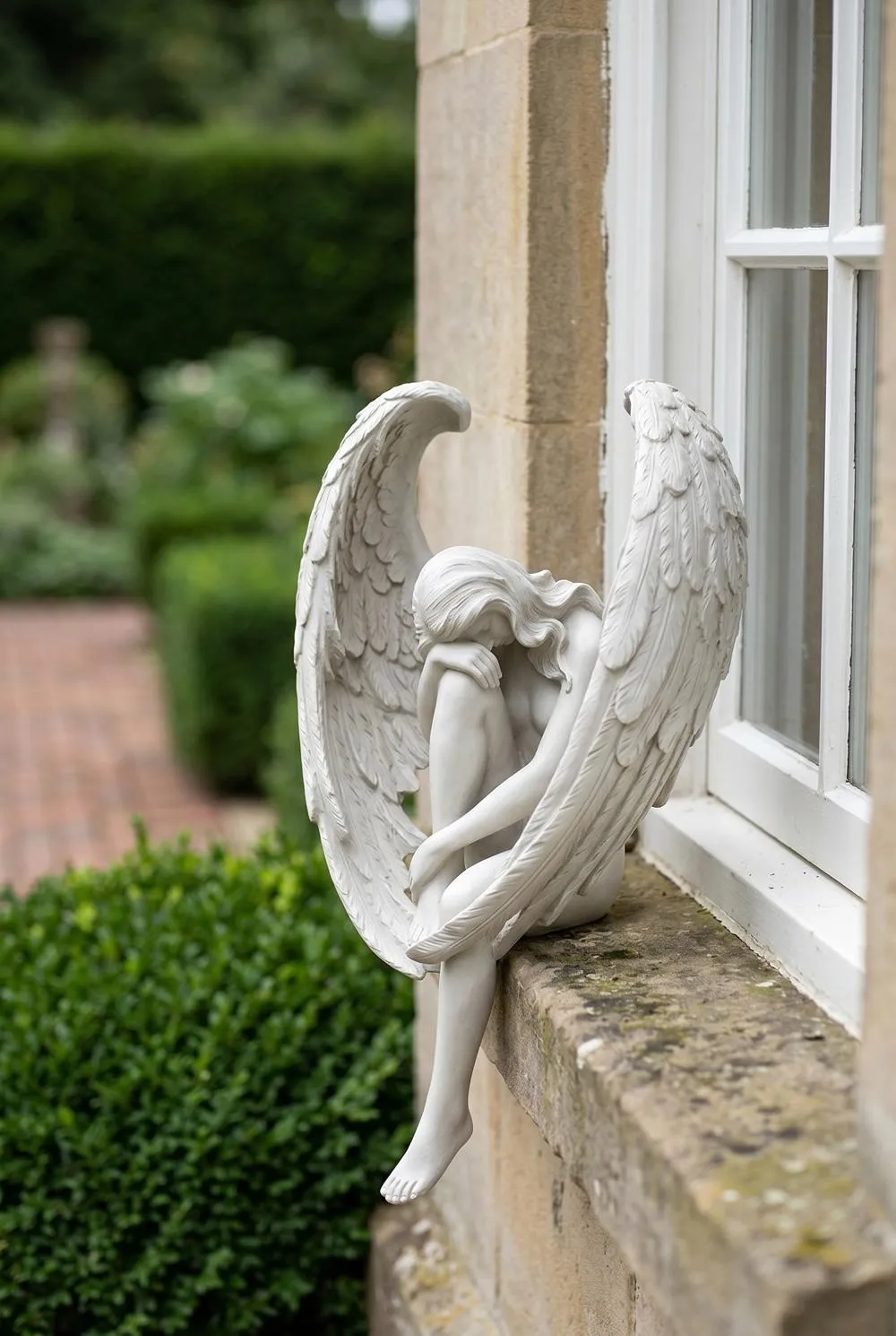 The Anguished Angel Long-Winged Sitting Statue